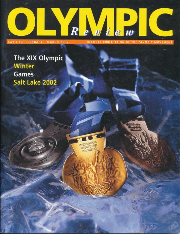 Bucheinband des *Olympischen Überblicks* mit mehreren Medaillen in verschiedenen Größen und Farben und fetter Schrift.
