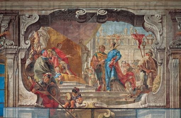 Ein lebendiger und detaillierter Fresko auf einer Decke, das eine Gruppe von Menschen, Skulpturen und Gegenstände in einer Mischung aus traditioneller und moderner Kleidung darstellt, realistisch wiedergegeben.