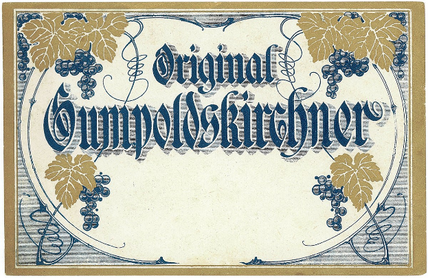 Alter deutscher Wein-Etikett mit einer Abbildung von Trauben und Blättern sowie Text, der den Wein-Typ angibt.